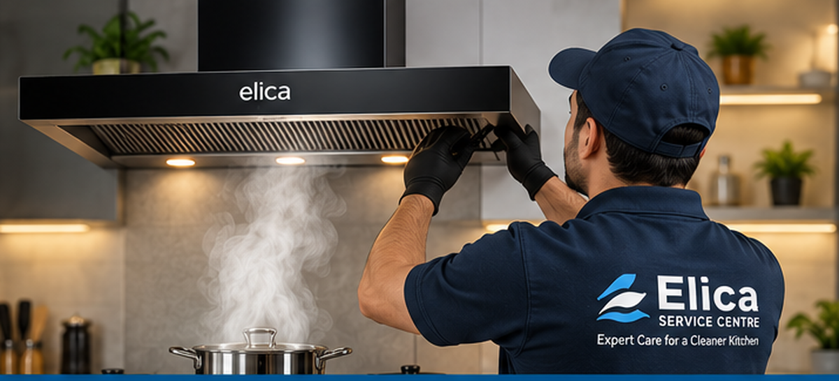 Kitchen chimney service technician working on a chimney in a modern kitchen